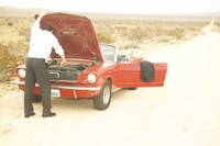 Photo of a car broken down in a desolate area