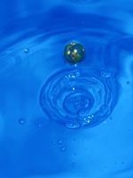 Photo illustrating earth going down the drain.