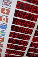 Board showing global currencies representing the global economy