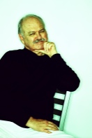 Photo of a mature man sitting and thinking