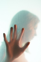 Photo of a woman in sorrow, blurred and looking away